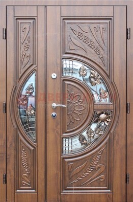 Уличная дверь в цвете Итальянский орех с виноритом и ковкой со стеклом ДВТ-147 в Ивантеевке